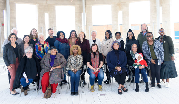 Start.coop Spring 2023 Cooperative Business Accelerator Class Group Photo, Valerie from Walnut Studiolo Seated in Front and Center of a Group of about Two Dozen