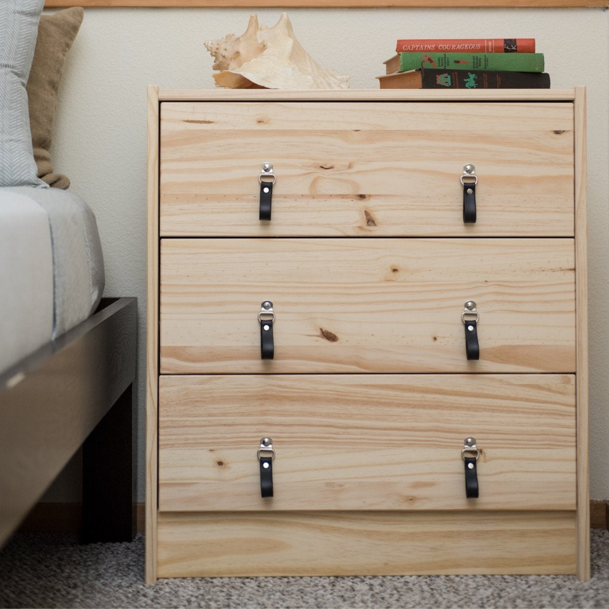 Knotty pine wood IKEA RAST dresser with handcrafted hinged black leather handles by Walnut Studiolo with nickel swinging hardware. 