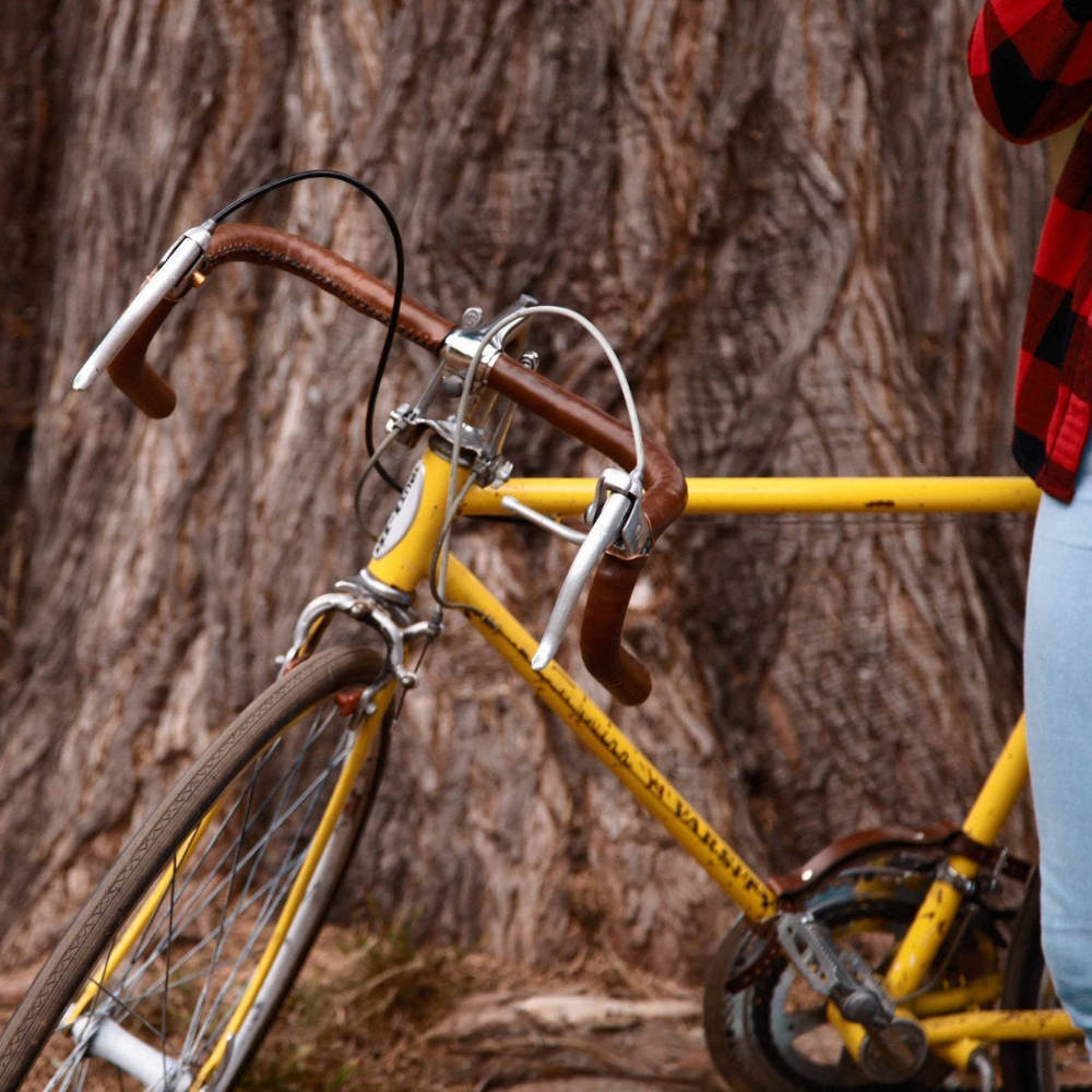 Customer photo of vintage yellow Varsity bicycle with dark brown leather sew-on bar wraps on standard drop bar handlebars with brake hoods.